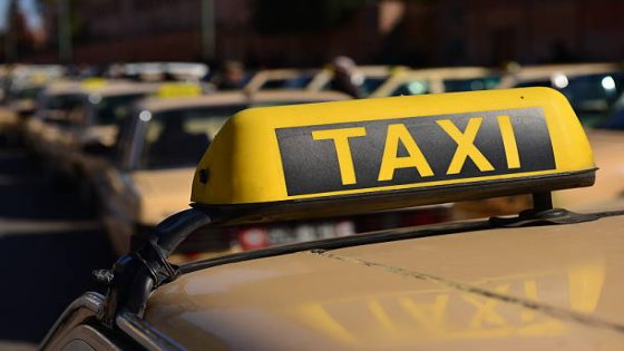 Abstract image of the city taxis queuing for customers with the background defocused.